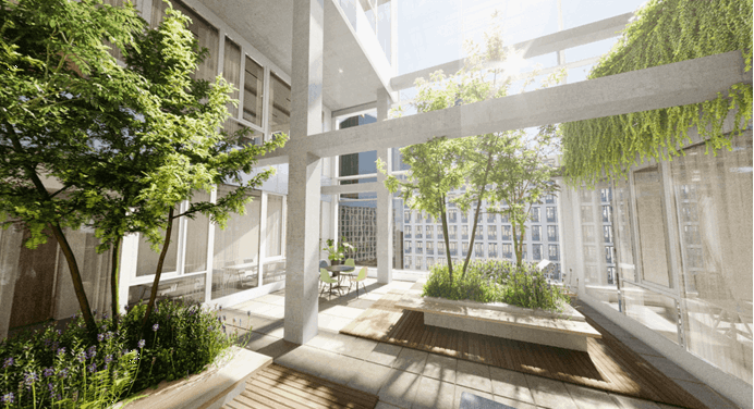 Foto van kantoorgebouw met heel veel groen in een open ruimte van het gebouw 