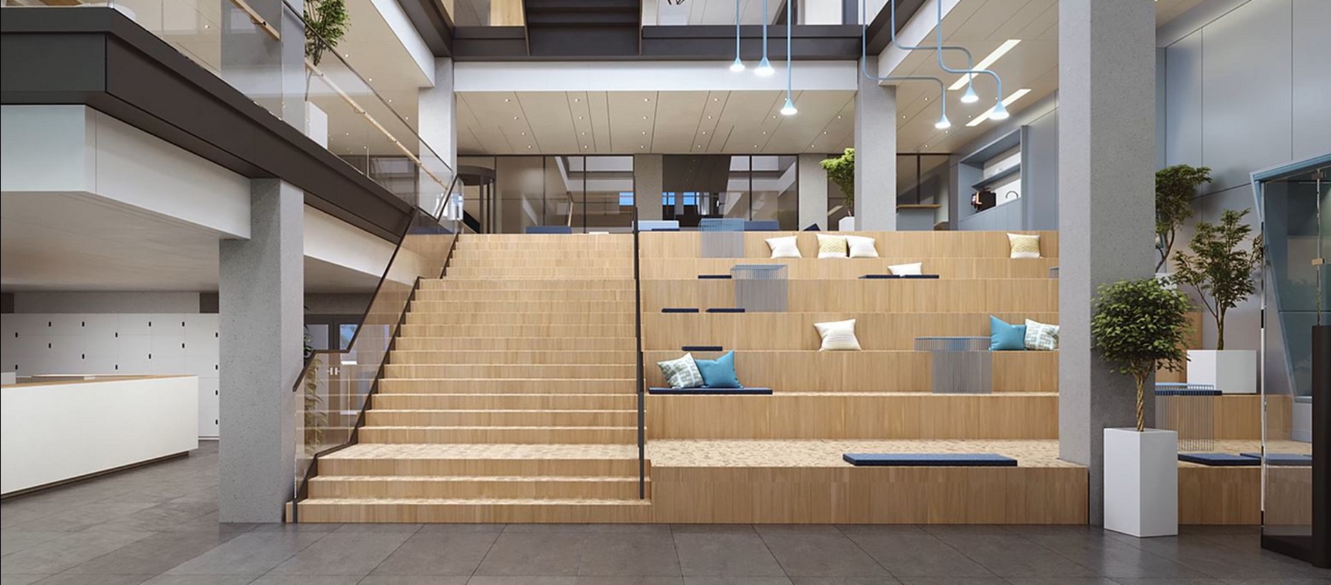 Trappen en houten zitplekken in een brede hal van een gebouw